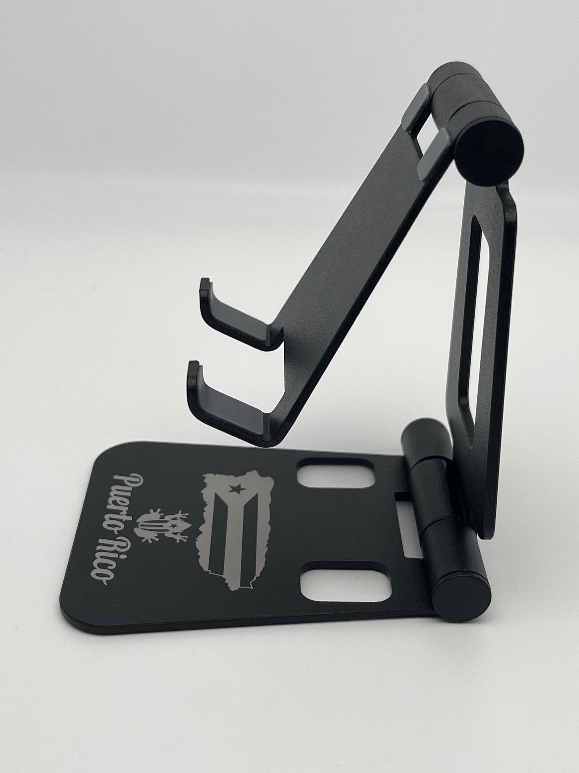 Soporte para teléfono plegable de aleación de aluminio de doble eje, color negro, con recuerdos de Puerto Rico